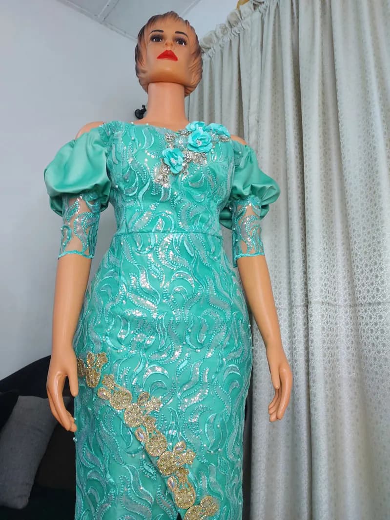 Turquoise sequin lace gown