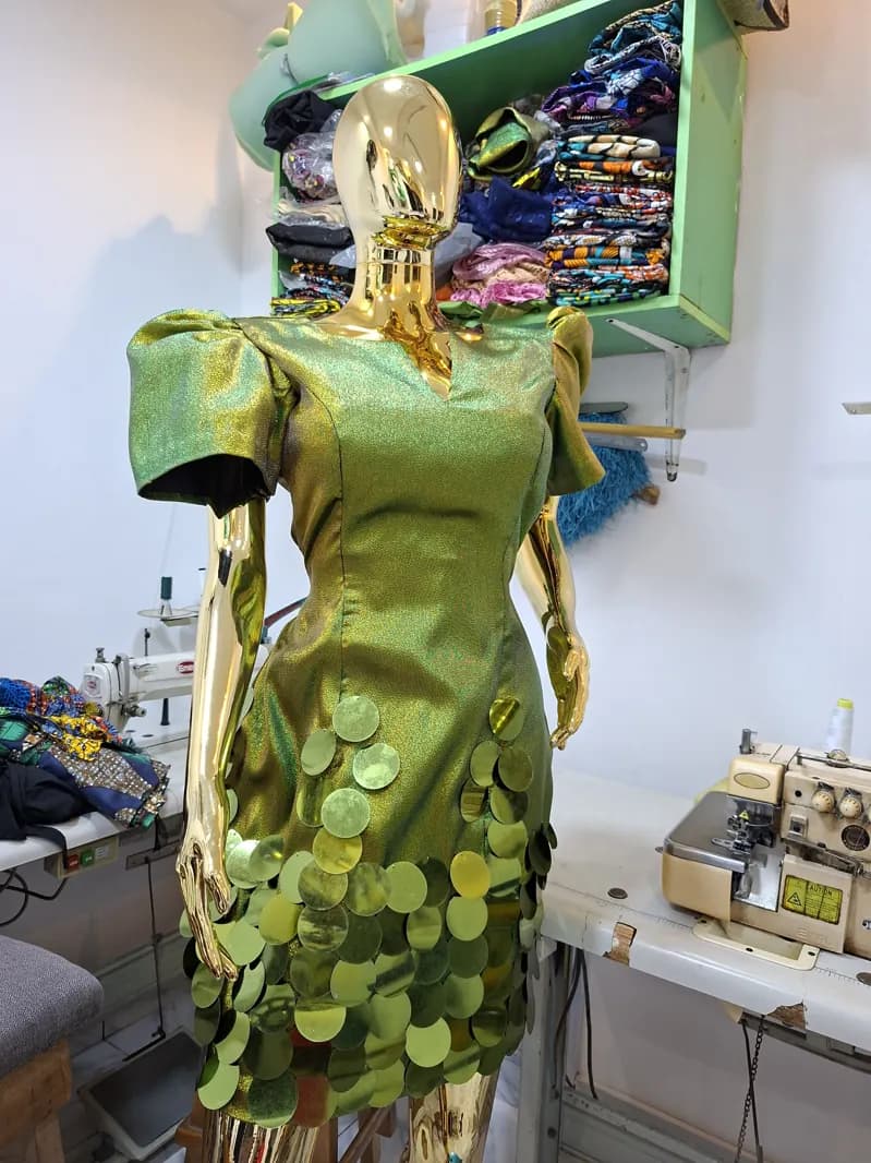 Green brocade dress with petal skirt