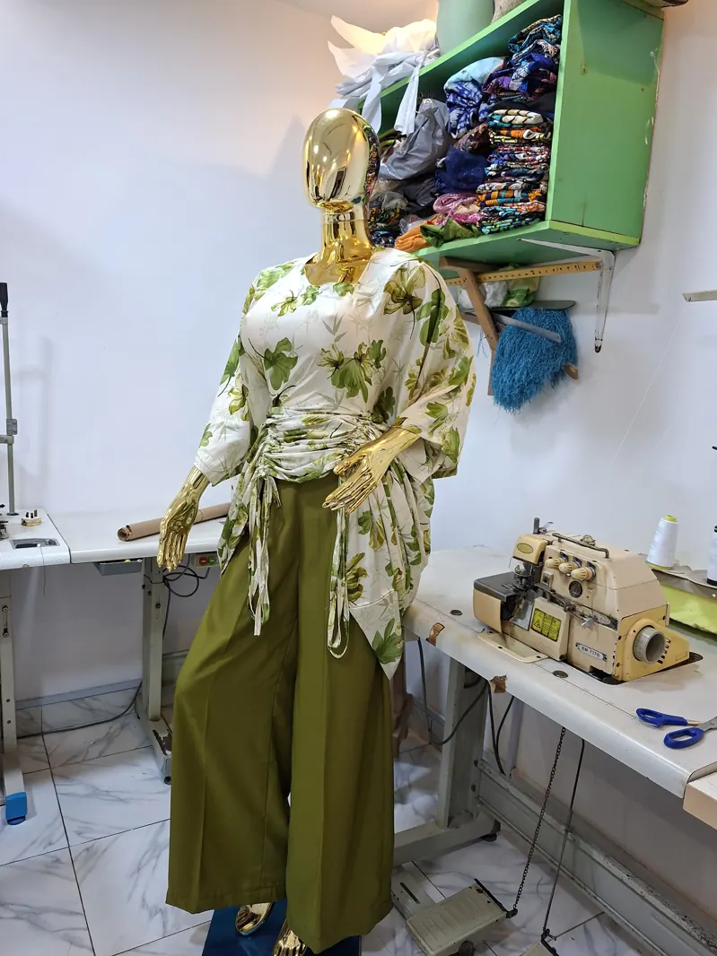 Leaf-print blouse and olive trousers