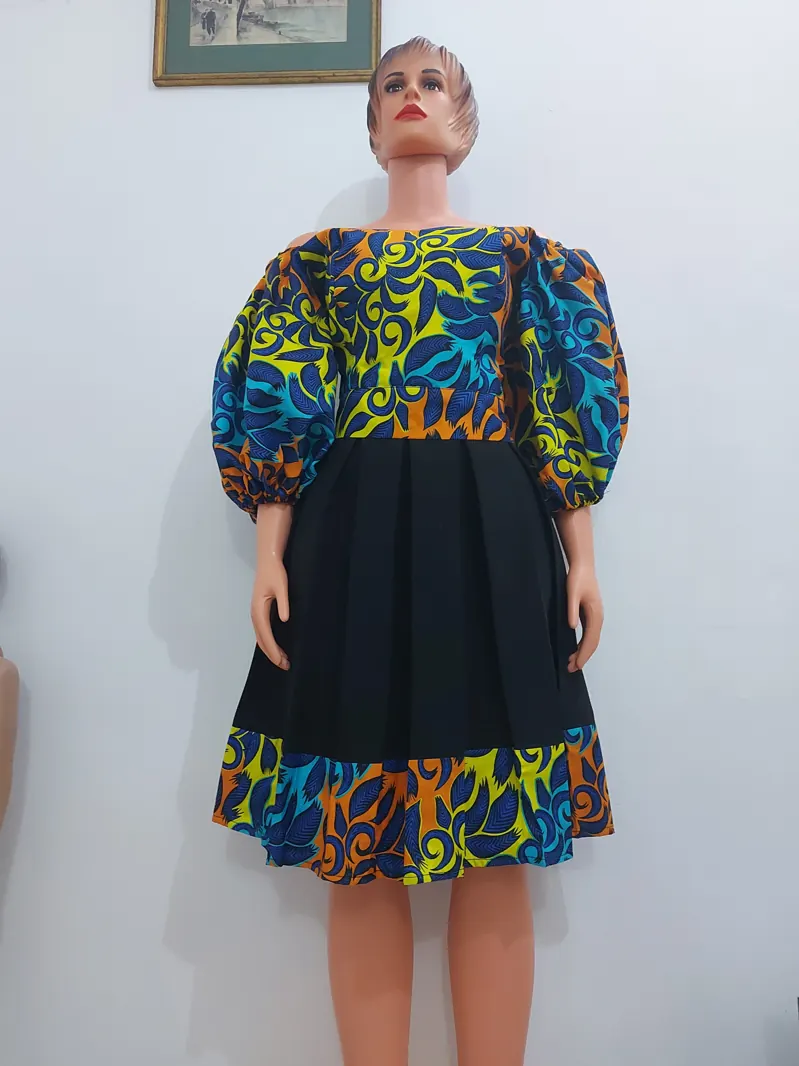 Ankara puff-sleeve top and black skirt