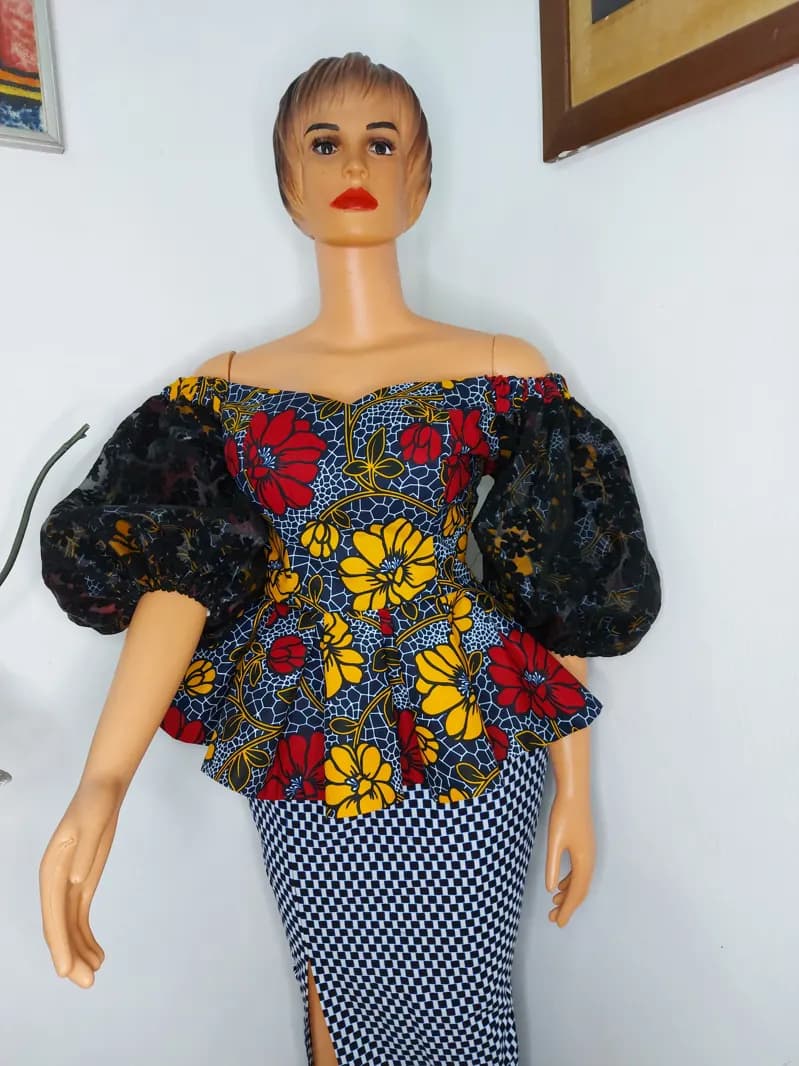 Floral peplum blouse with lace puff sleeves