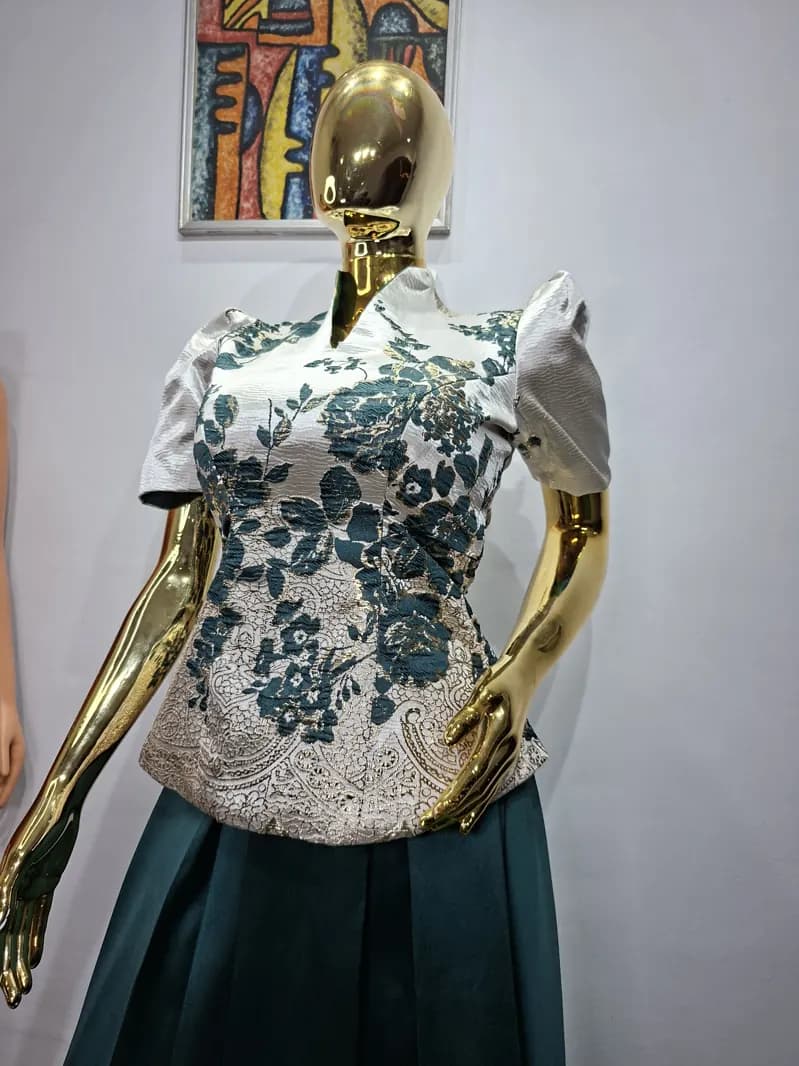 Embroidered white peplum blouse and skirt