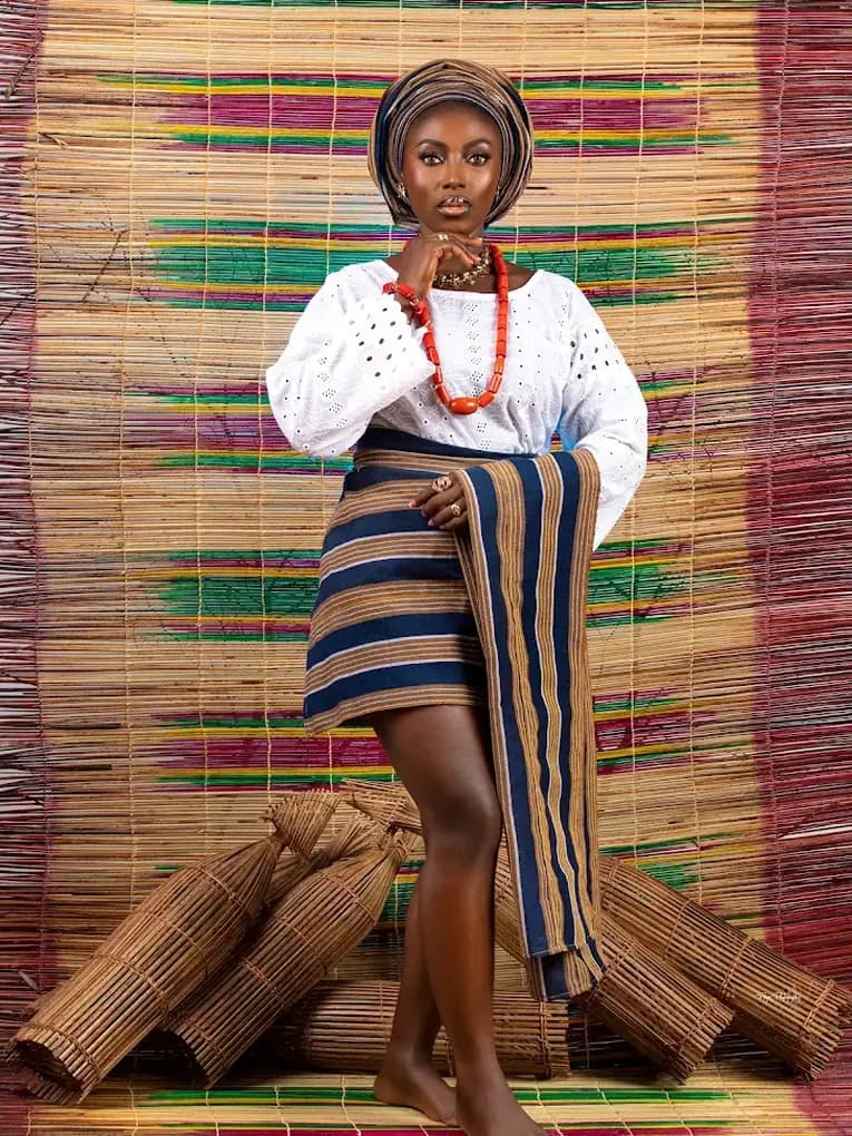 A piece by G’s La Clothier, worn with a gele and coral beads