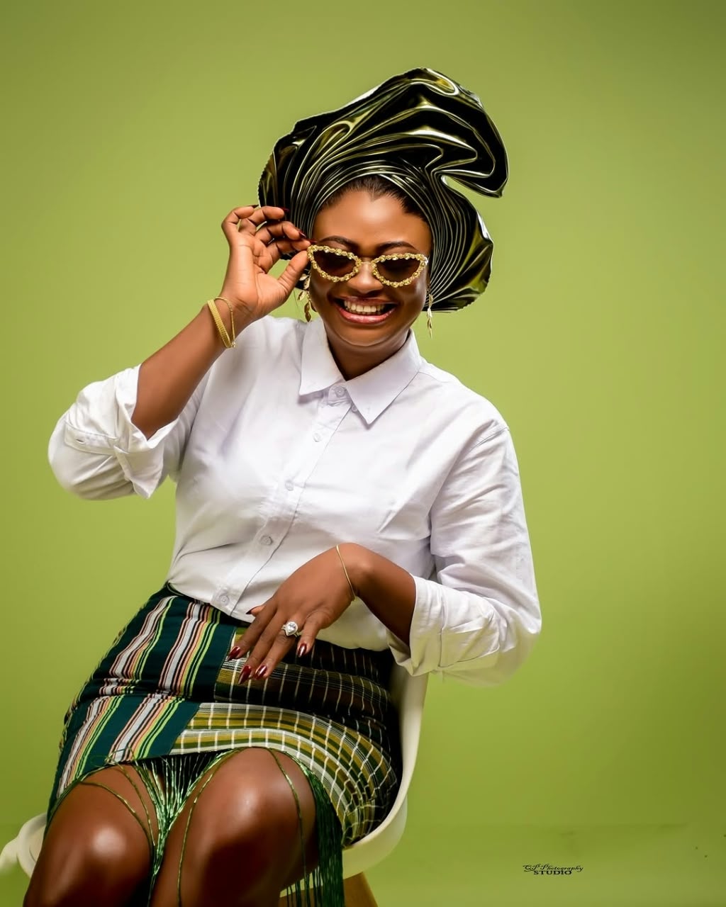 Striped green skirt, white shirt and gele